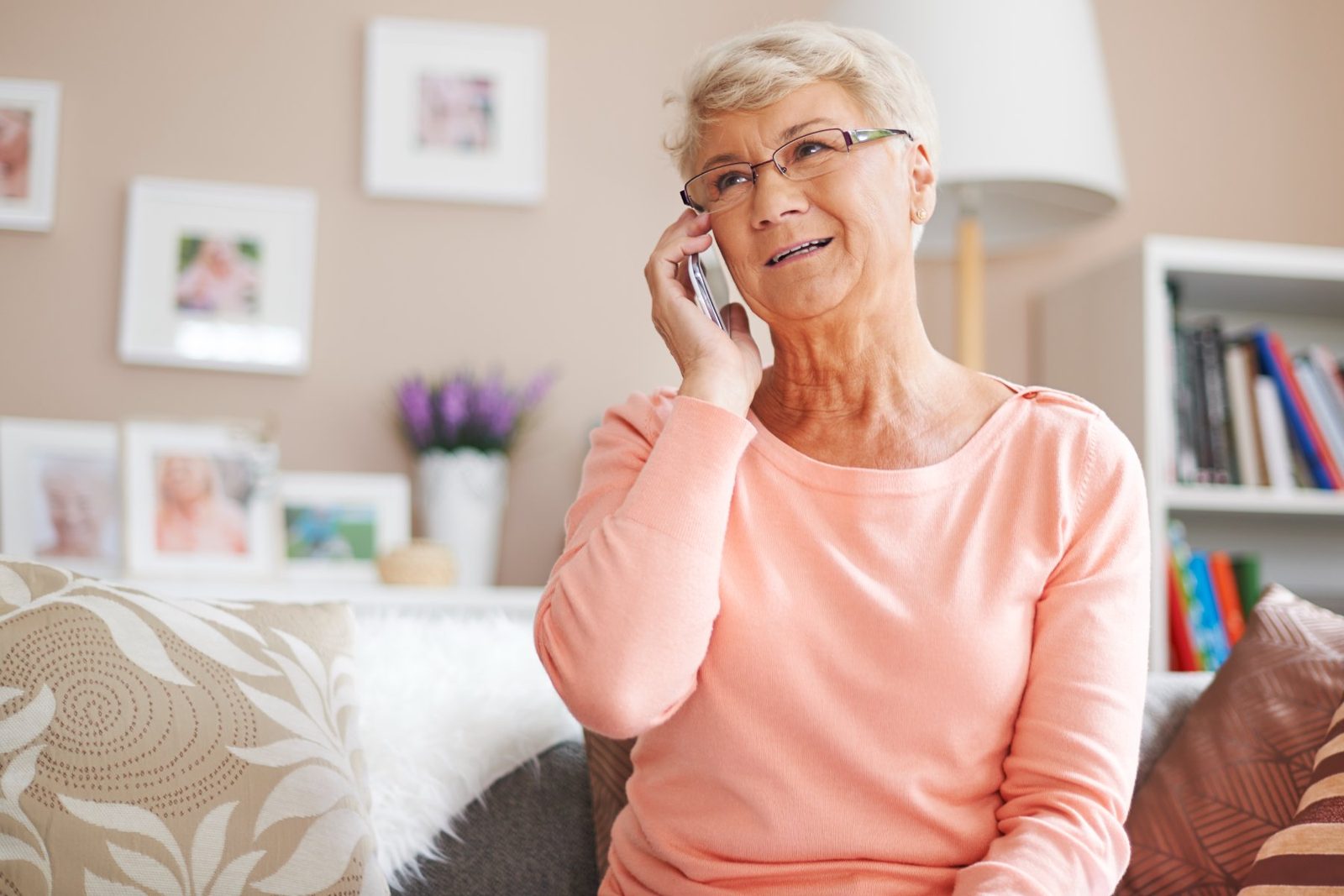 Older woman at home on the phone